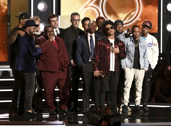 Bruno Mars, foreground center, accepts the award for album of the year for "24K Magic" at the 60th annual Grammy Awards at Madison Square Garden on Sunday, Jan. 28, 2018, in New York. (Photo by Matt Sayles/Invision/AP)